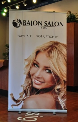 Eye catching displays are a great way to attract attention.  (Display banner by Signs Now Cincinnati for Bajon Salon, West Chester, OH)