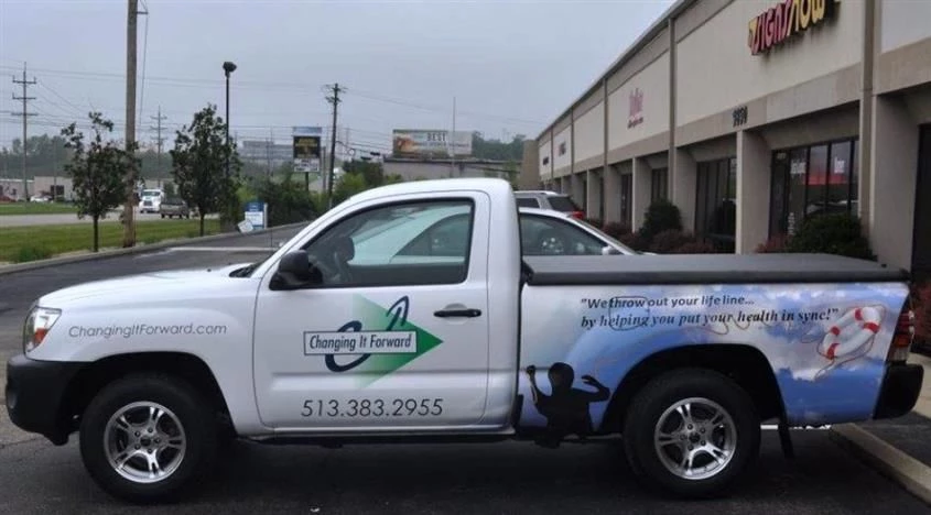 Move your business forward... with custom vehicle graphics!  (Digitally Printed Vehicle Graphics by Signs Now Cincinnati for Changing it Forward Inc., Cincinnati, OH)